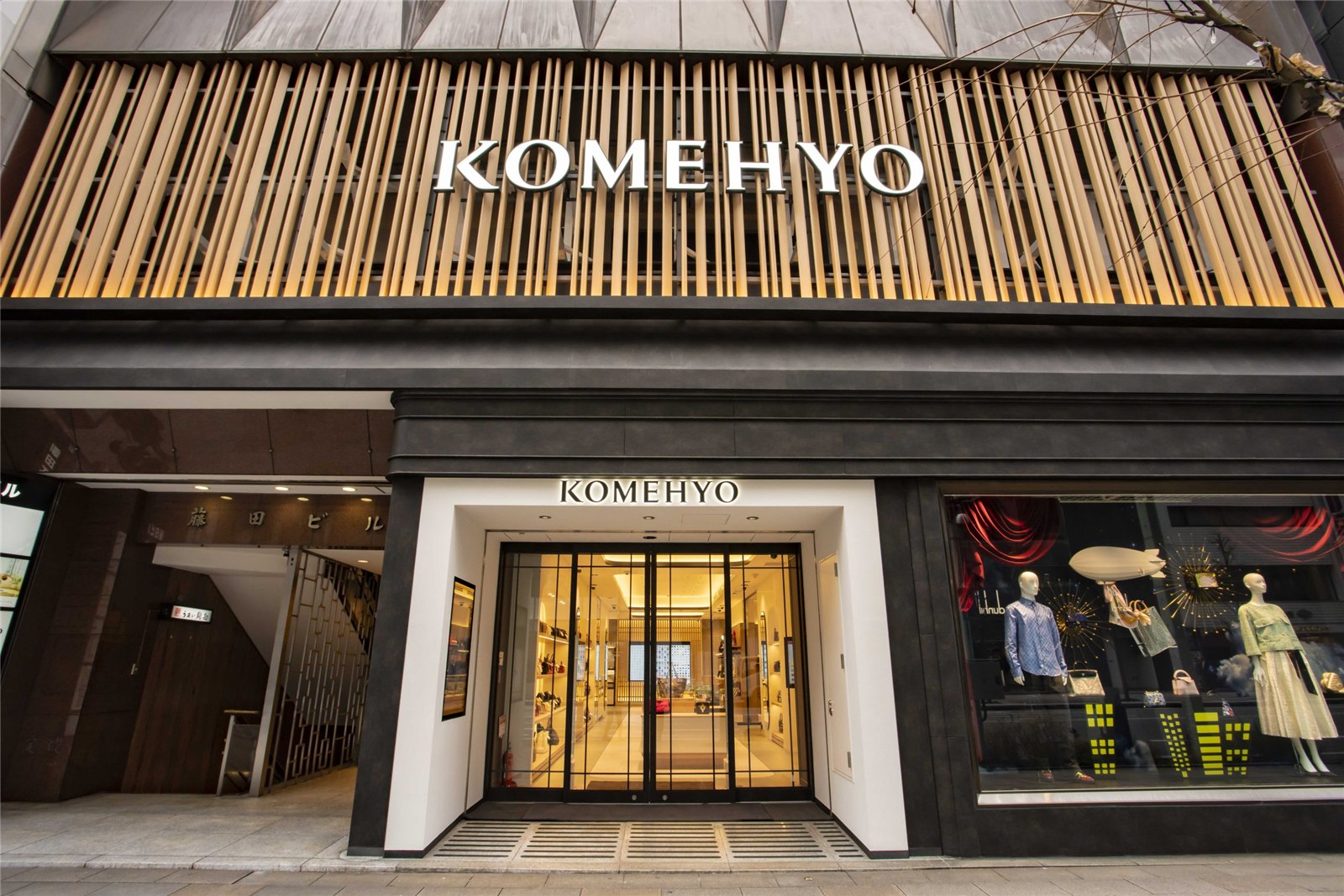 Pre-owned luxury watches and brand-name goods in a display case — Komehyo is Japan's largest reuse retailer