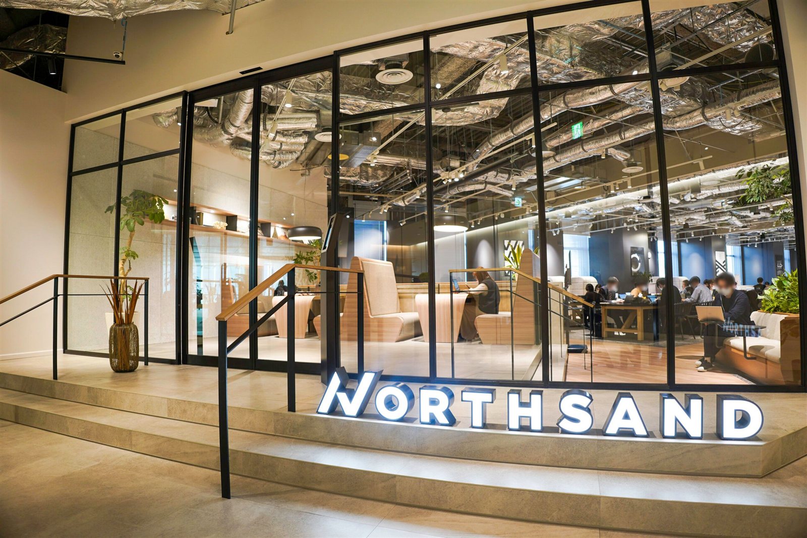 Modern Tokyo office tower — North Sand is an IT and project-management consultancy