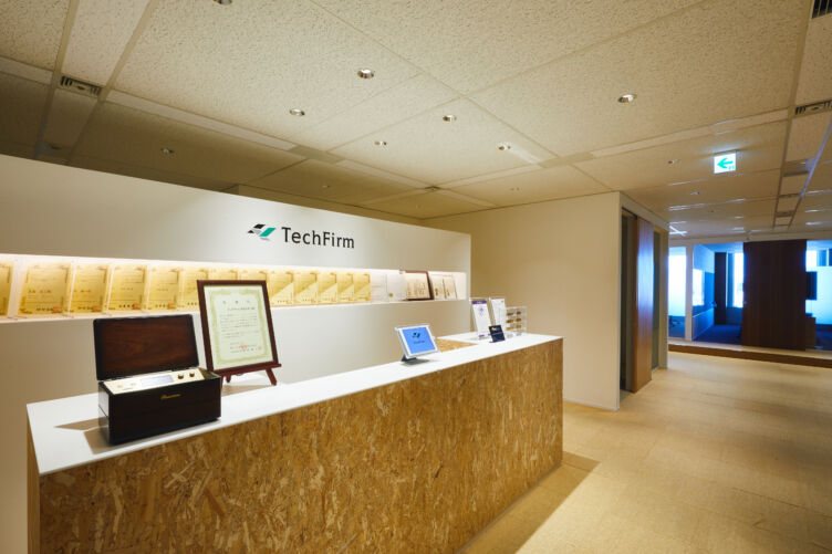 Shinjuku high-rise office district, Tokyo — TechFirm Holdings is an independent IT and system-development group based in Shinjuku